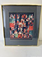 Frontal view of framed Paul Klee cityscape print