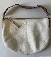 Front view of Coach ivory pebbled leather hobo bag