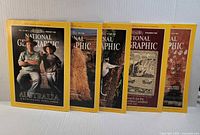 Five National Geographic magazines standing front facing