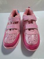 Front view of pair showing bubble pattern, Velcro straps and brand marking