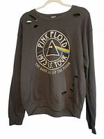 Full view of sweatshirt front showing graphic and distressing