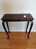 Full view of the wood console table against wall