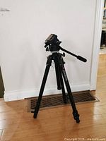 Full view of Manfrotto tripod standing extended