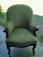 Front view of green wingback chair