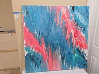 Front view of abstract acrylic pour painting