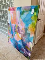 Front view of multicolor abstract painting on canvas