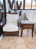 Front view of arm chair and side table together