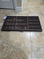 Full view of wooden compositor drawer showing compartment layout