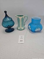 Group shot of covered dish, pitcher and vase