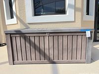 Front view of Keter resin deck box closed
