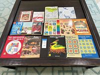 All 15 books laid out on coffee table