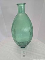 Full view of seafoam green ribbed glass vase front