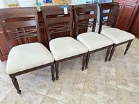 Front view of four matching dining chairs