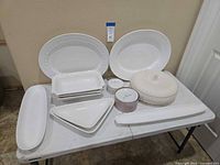 All twelve serving pieces arranged on table