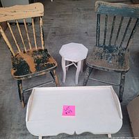 All four items: two green chairs, white lap table, white stool