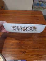 Side view showing brown Vine pattern and dish profile