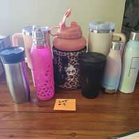 Group shot of all seven drinkware items on table