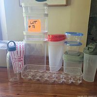 All items grouped: egg tray front, drink bottles left and right, popcorn tub, tall dry goods containers, cereal saver, round and rectangular containers