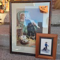 Both framed prints side by side on steps