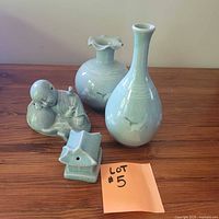 All four celadon pieces grouped on table