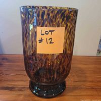 Full view of vase showing tortoiseshell pattern and pedestal