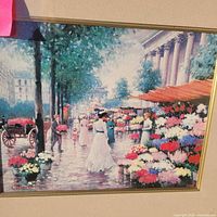 Close-up of print showing market scene and artist signature