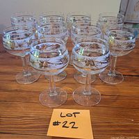 Full set of ten Libbey frosted pinecone glasses on table