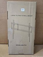 Sealed retail box showing illustration of large tilting TV wall mount, model EBLTK4