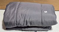 Folded gray comforter overall view