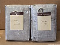 Front view of both packaged Brooke curtain panels