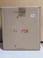 Factory-sealed cardboard box marked Storex, containing boot trays