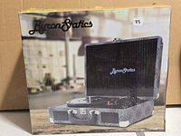 Front of retail box showing Byron Statics suitcase turntable