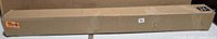 Full view of sealed long rectangular box containing the roller shade