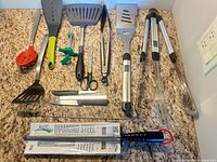 All 14 utensils laid out on countertop