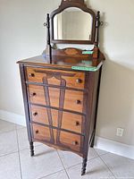 Perspective view of full dresser showing mirror, drawers, legs