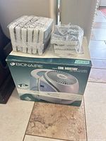 Bionaire humidifier boxed with two packs of sealed wick filters on top