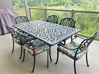 Full dining set showing table and six chairs