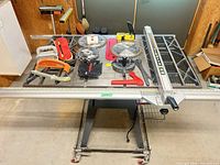 Overall view of table saw with accessories laid out on top