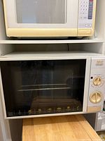 Front view of DeLonghi Alfredo toaster oven showing controls and door