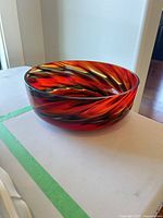 Side view of handblown glass bowl showing swirl colors