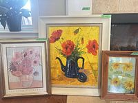 All three framed artworks side by side