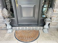 Both pineapple finial pedestals positioned at doorway