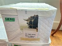 Quilted storage box with Peill Venus label attached
