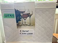 closed quilted storage box with label indicating contents