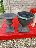 Two urn planters side by side on deck