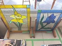 Both stained glass panels on stands showing overall appearance