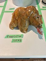 Right side view of soapstone bear sculpture showing dimensions note