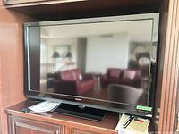 Front view of Sony 52-inch LCD TV on cabinet