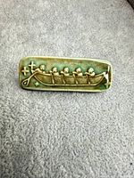 front view showing boat motif and glaze colors