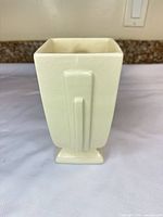 front view showing overall shape, color and pedestal base